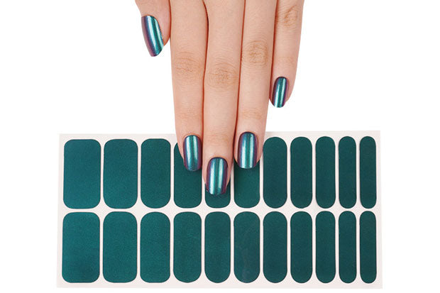 A hand showing 22 green to purple colour shift nail strips