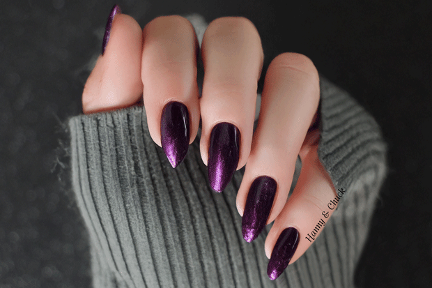 Customer image of dark purple nail wraps on a grey background