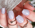 A close-up image of a person's nails painted in a misty lavender color, with the text 'Misty Lavender - 3 left' overlayed.