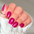 Dark pink glitter nail wraps on hand, Starlight Cabaret by Hanny and Chuck