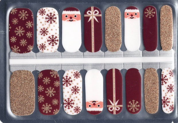 Set of 16 nail art stickers with winter-themed and Christmas designs in a clear plastic package.