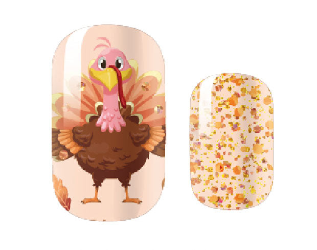 Close up sample image of our Thanksgiving nail wraps. Showing turkeys and glitter in autumn colours.