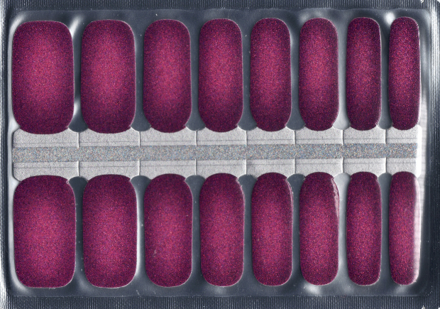 Set of 16 glittery purple nail polish strips in a silver package