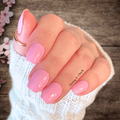 Hand wearing bubble gum pink nail wraps