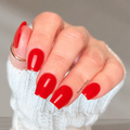 Hand with red nail wraps wearing a white textured sleeve, with 'Hanny & Chuck' branding.