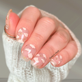 Sheer nail wraps with white cloud design and gold stars on natural nails