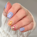 Easter bunny nail wraps with blue polka dot and floral design on short square nails