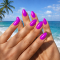 Hand wearing Electric Purple neon nail wraps on almond-shaped nails at the beach