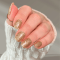 gold glitter nail wraps with fine shimmer on short nails