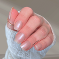 Soft pearl shimmer nail wraps with a sheer glossy finish