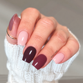 One Vibe deluxe nail polish wraps in pale pink, mauve, berry and deep plum on a mixed manicure