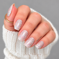 Pardon My Sparkle nail wraps on square nails, featuring fine and chunky holographic glitter on a semi-sheer nude base.