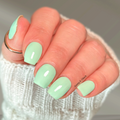 Pastel mint green nail wraps on hand with glossy manicure finish by Hanny and Chuck