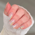 Pastel stripe overlay nail wraps with gold glitter on short nails