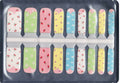 Picnic Pals pastel nail wraps for kids — sheet of 18 wraps with cherry, daisy, strawberry, heart, and polka dot prints