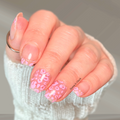 Pink Prowl pink leopard print nail wraps on short natural nails with gold accent details