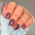 Plum Supernova nail polish strips on nails showing gradient from deep purple to burnt orange