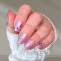 Purple gradient floral nail wraps with shimmer finish on natural nails