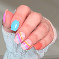 Retro rainbow nail wraps with pastel stripes and colourful nail art on short nails