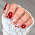 Rosy Reindeer Nail Polish Wraps on a Hand With Ruby Glitter Nails and Blush Pink Reindeer Accent Nails With Berry-Tipped Antlers