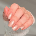 sheer beige nail wraps with soft shimmer on natural nails