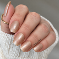 sheer beige nail wraps with soft shimmer on natural nails