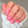 Sheer bubblegum pink nail wraps with iridescent blue shimmer on short square nails