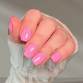 Close-up of soft pink glossy nail wraps applied to short, rounded nails. This easy at-home manicure offers a smooth, salon-quality finish with a clean, minimal look—perfect for everyday wear.
