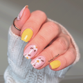 Yellow and pink daisy floral nail wraps on short square nails, spring manicure by Hanny & Chuck.