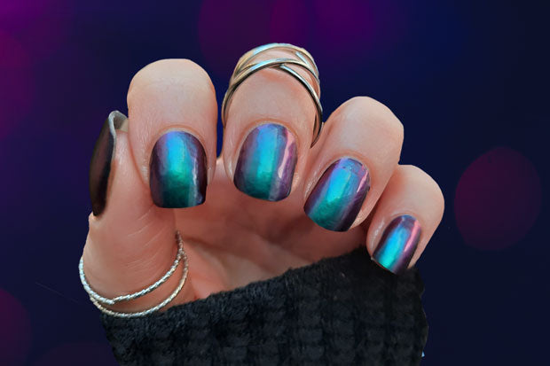 A hand showing dark green and purple Colour Shift Nail Strips