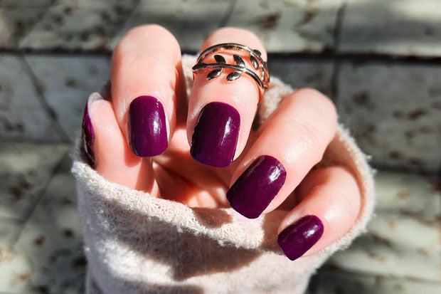 Nails showing very dark purple nail wraps